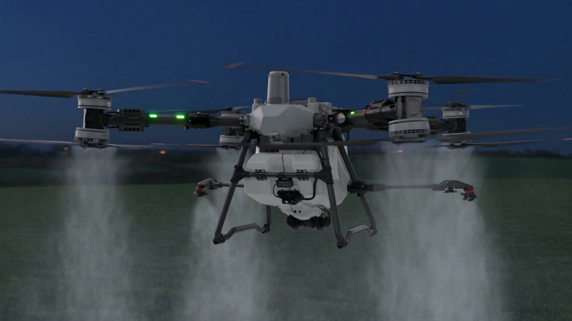 An agricultural drone flying low over the crop, spraying from its nozzles