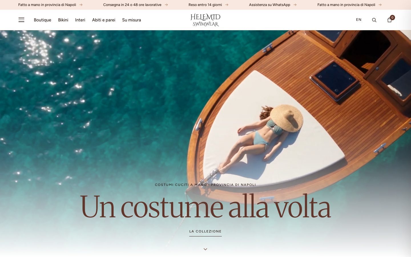The Helemid Swimwear home page, with a wooden boat on turquoise water