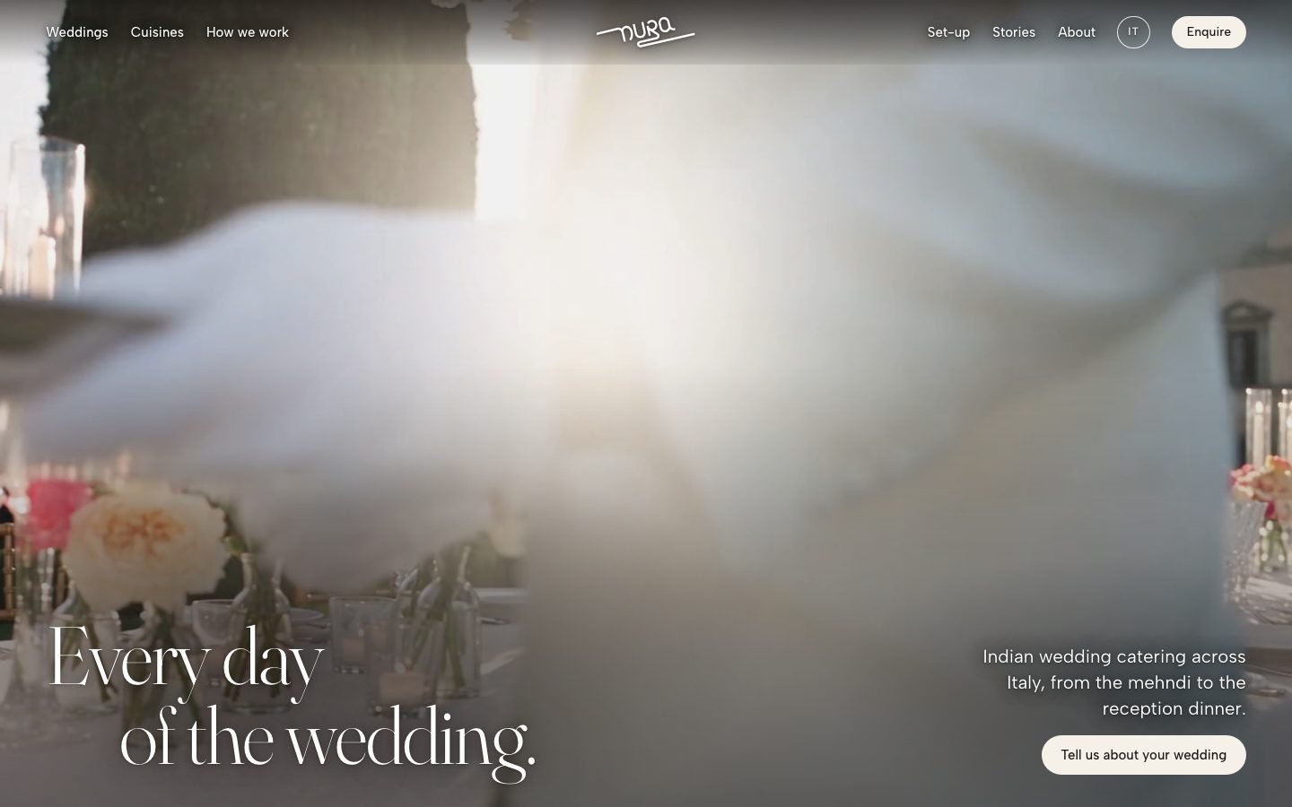 The NURA home page, with a long table set on the lawn in front of a Tuscan villa
