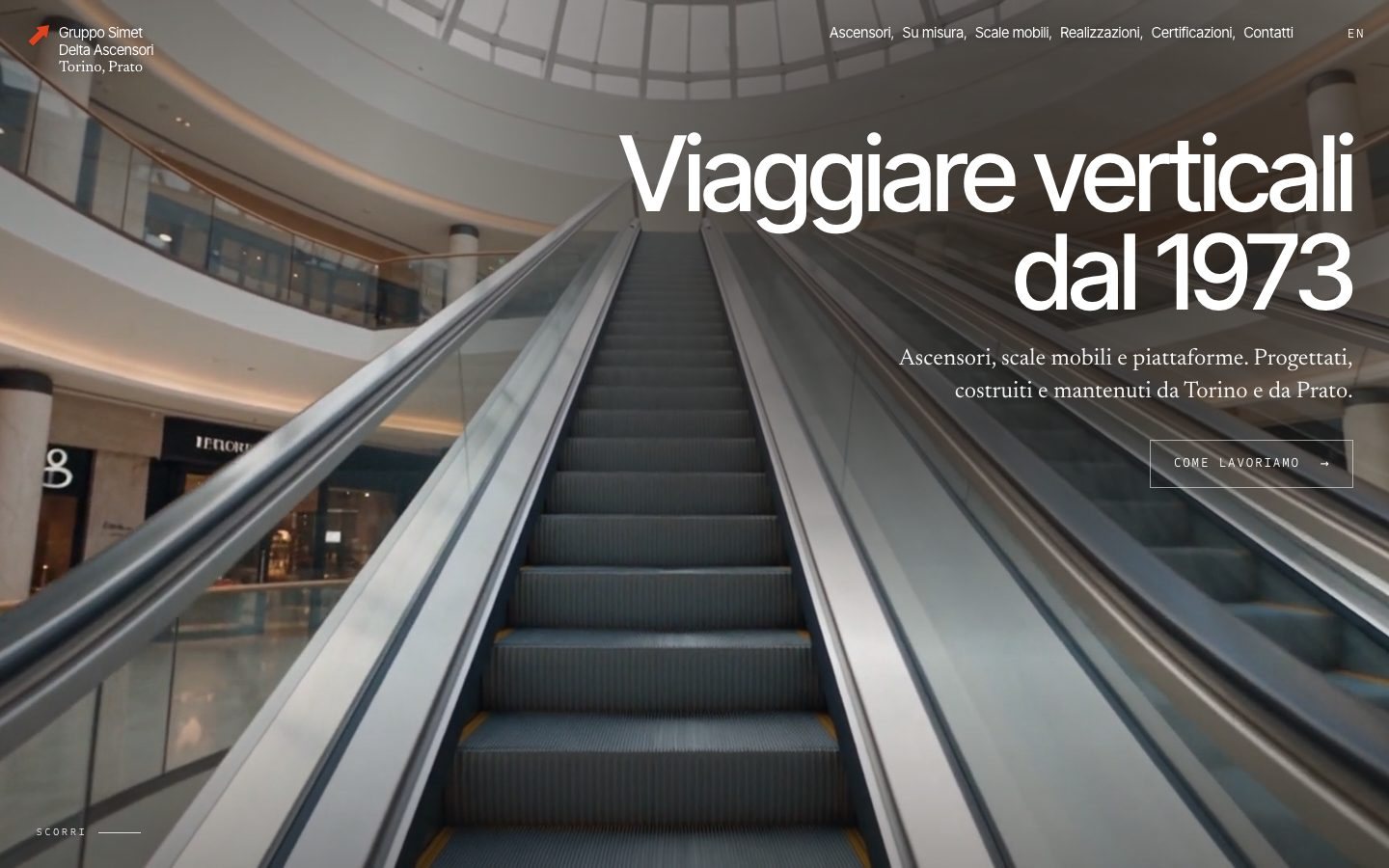 The Gruppo Simet and Delta Ascensori home page, with a glass lift in a spiral stairwell
